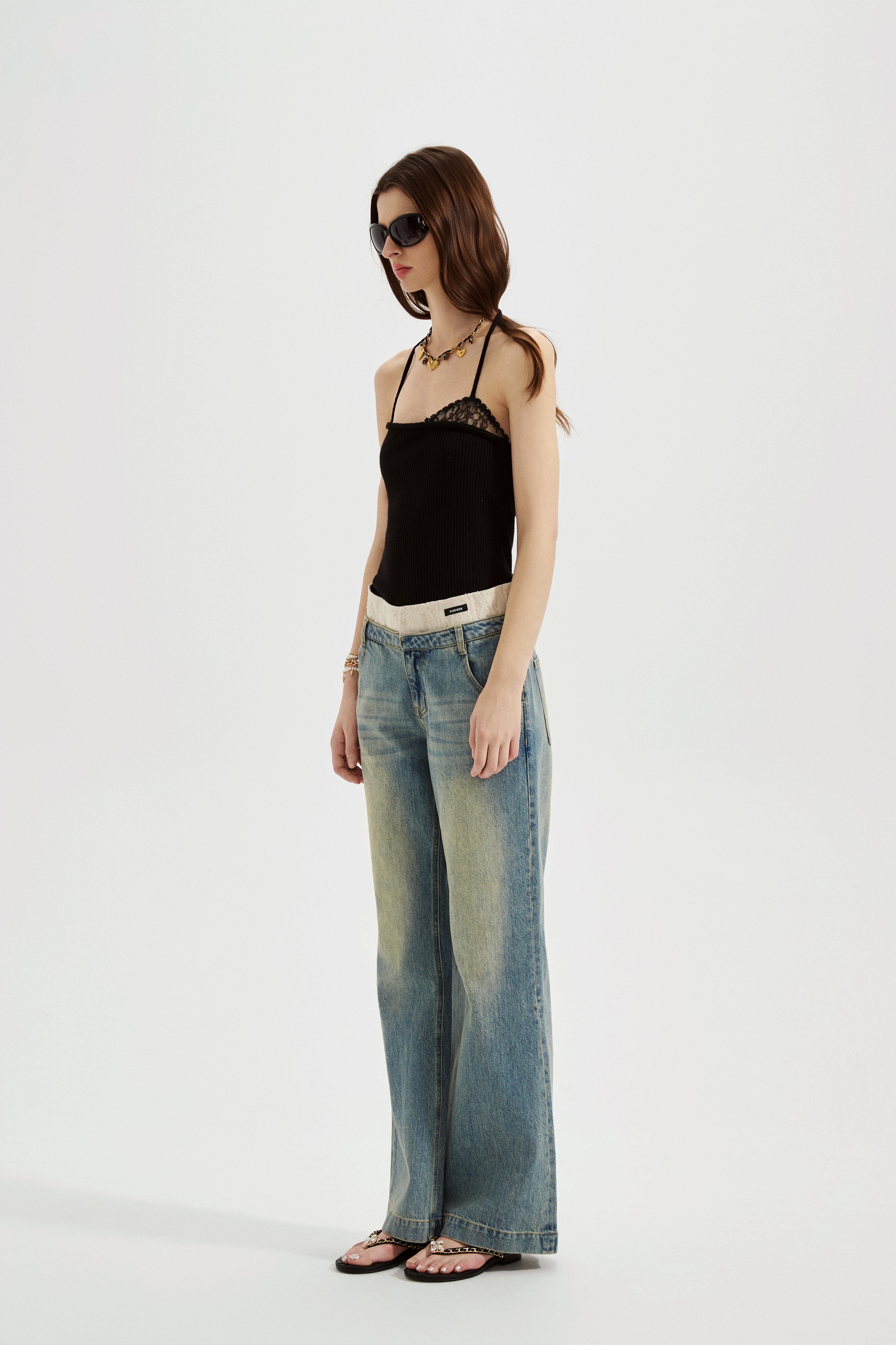 Black halterneck knit top with lace panels