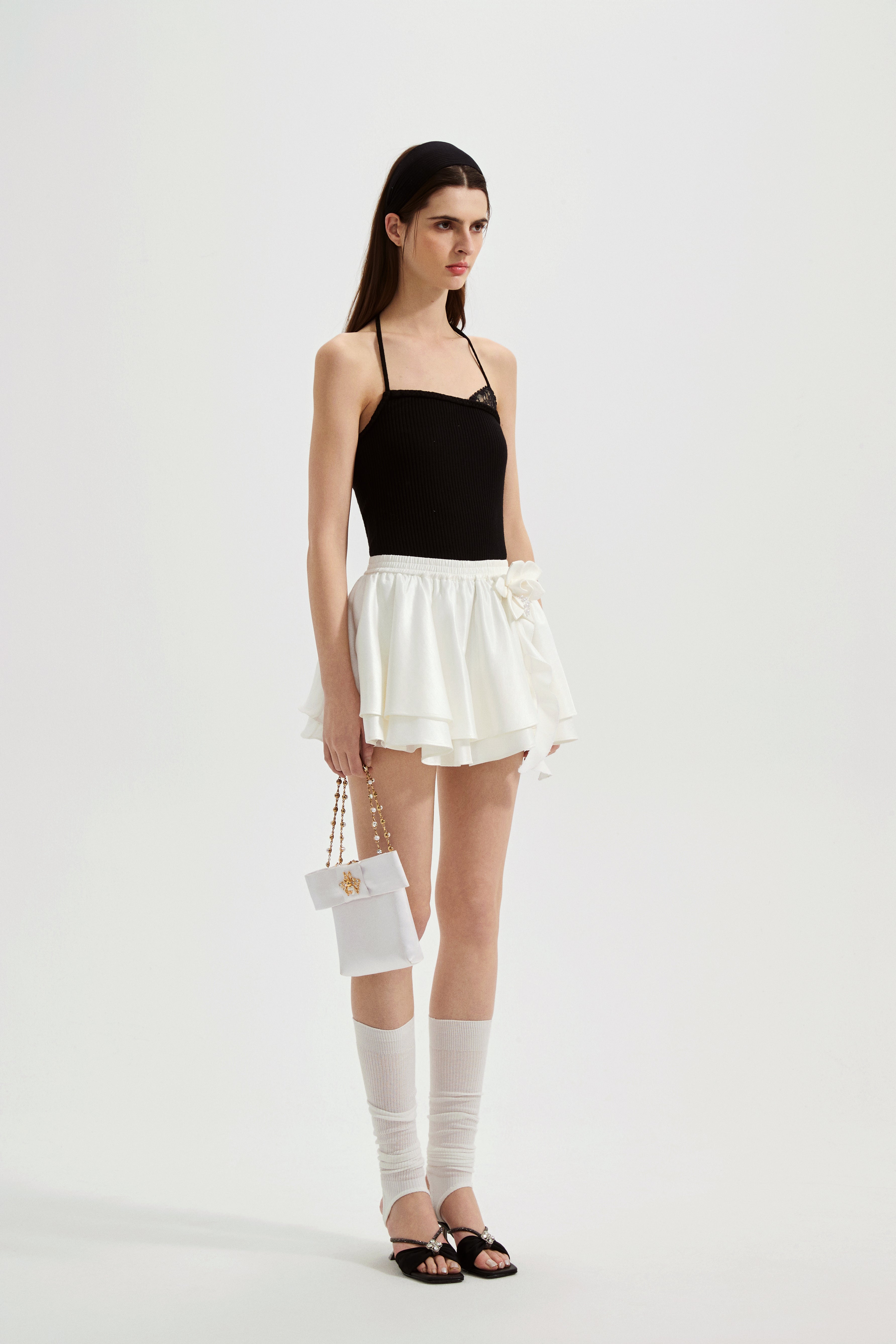 Black halterneck knit top with lace panels