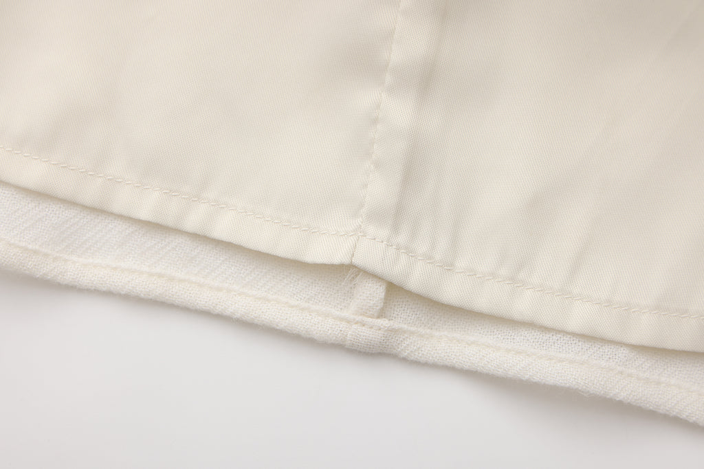 Beige V-Neck Blouse with Belt Buckle & Ruffle Trim