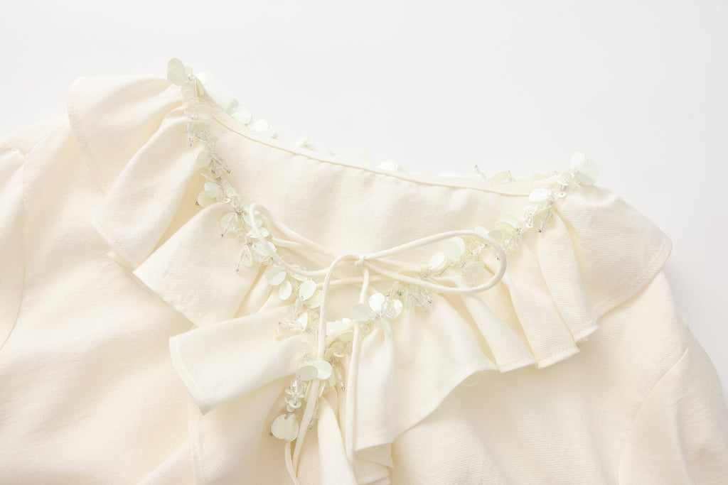 Oversized V-Neck Tie Top with Sequin Ruffle Trim